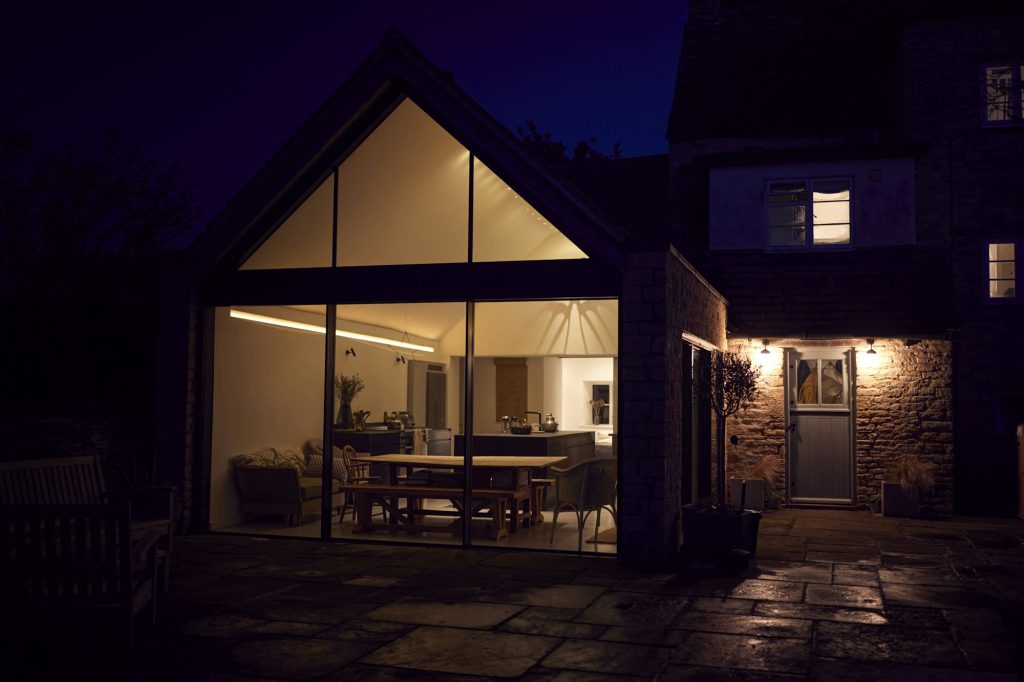 Exterior View Of Beautiful Kitchen Extension At Night