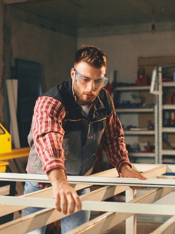 Young men in pvc carpentry workshop